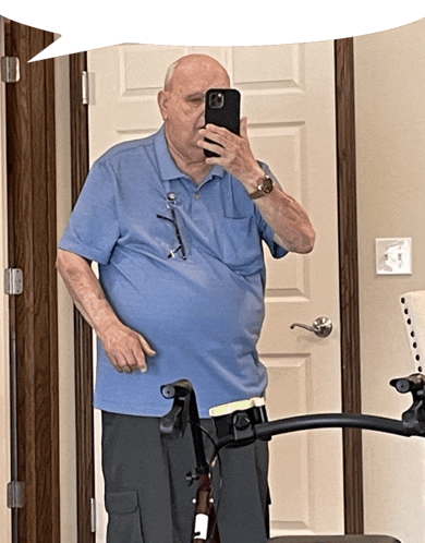 an elderly man taking a selfie with his phone