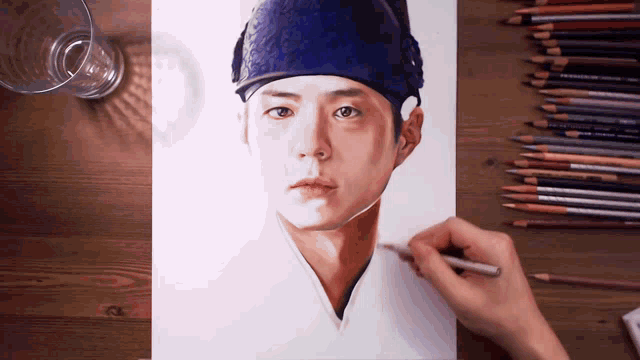 a drawing of a man wearing a blue hat with colored pencils
