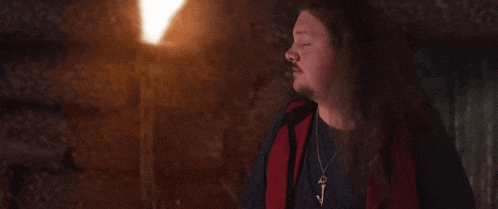 a man with long hair says that 's unpleasant in a dark room
