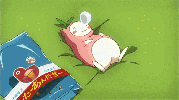 a cartoon character is laying on a bed next to a bag of chips