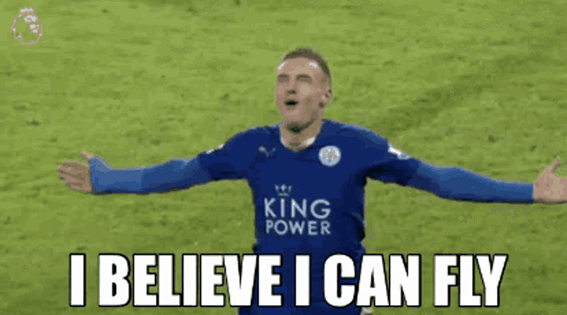 a soccer player with his arms outstretched and the words `` i believe i can fly '' behind him .