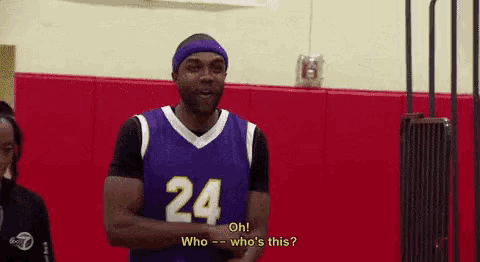 a man in a purple basketball jersey with the number 24 on it
