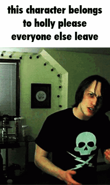 a man wearing a black shirt with a lightning bolt on it