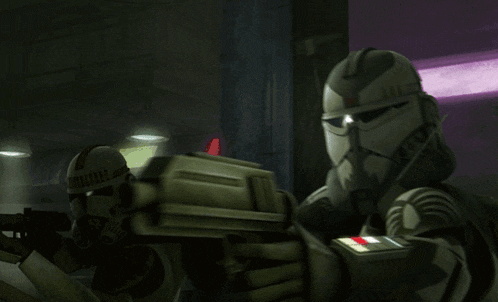 a clone trooper is holding a gun in his hand