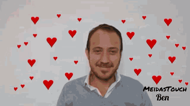 a picture of a man with red hearts around him and the name meidastouch ben