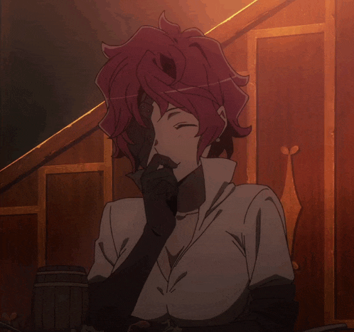 a woman with red hair and a white shirt is sitting in a dark room