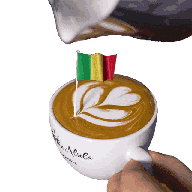 a cup of coffee that says written aliola on the side
