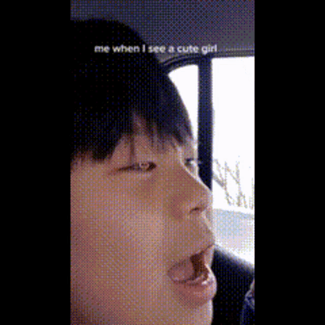 a close up of a person 's face with the words me when i see a cute girl below it