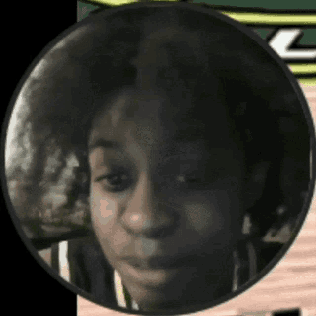 a close up of a person 's face in a round frame
