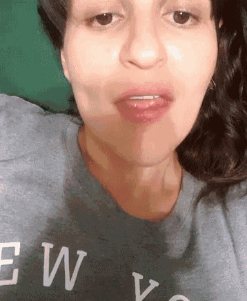 a close up of a woman wearing a shirt that says ew