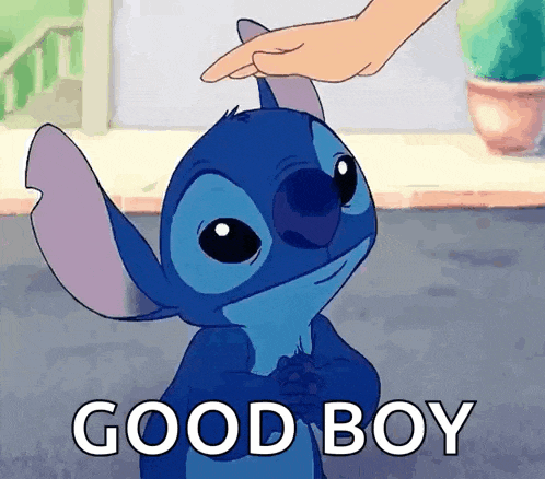 a person is petting a cartoon character 's head and says good boy .