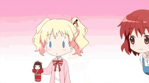 a girl with red hair is holding a doll while a girl with blonde hair looks on