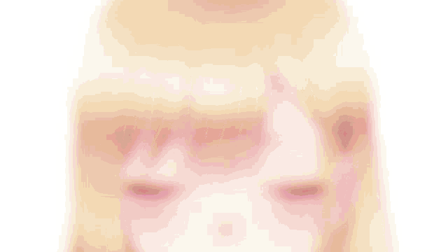 a close up of a girl 's face with red eyes