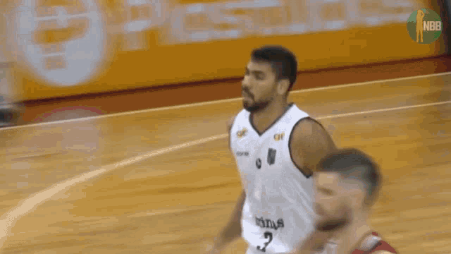 a basketball player in a white jersey with the number 16 on the back