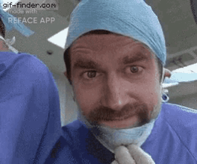 a man with a beard and mustache wearing a surgical cap and mask