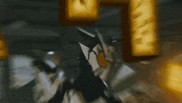 a blurred image of a person holding a sign that says n