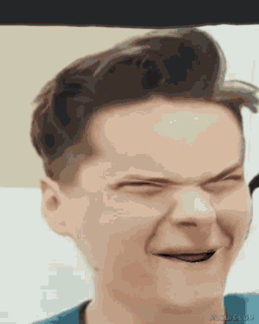 a close up of a man making a funny face