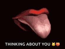 a close up of a woman 's mouth with her tongue sticking out and the words thinking about you