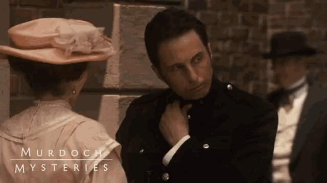 murdoch mysteries poster showing a man and woman