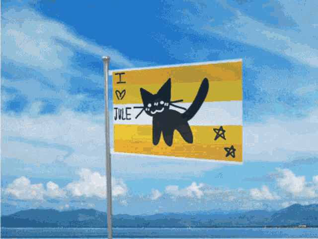 a yellow and white flag with a black cat and the words i love jule