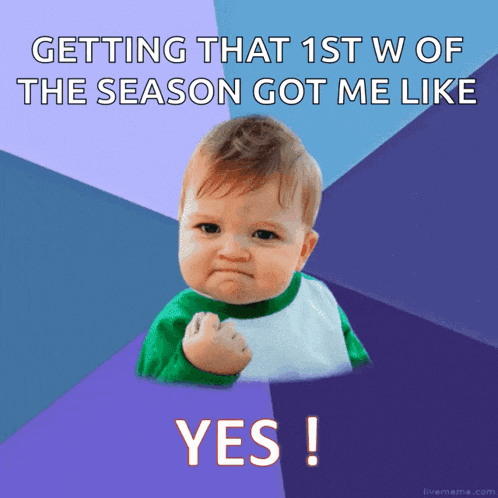 a baby with a fist in the air with the words getting that 1st w of the season got me like yes
