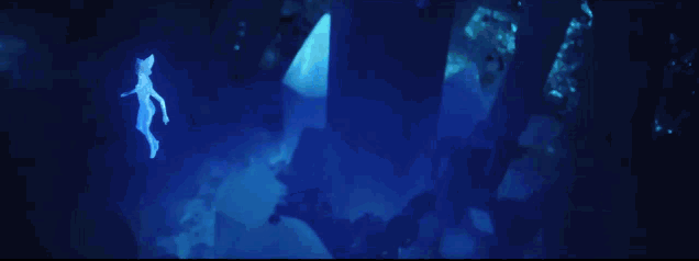 a blue background with a few pieces of paper floating in it