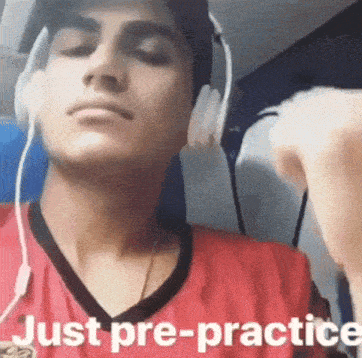 a man wearing headphones with the words just pre-practice below him