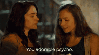 two women are looking at each other and one of them is saying `` you adorable psycho . ''
