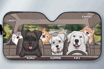 a car sun shade with dogs and cats in it