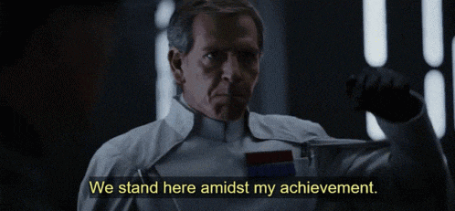 a man with his mouth open says we stand here amidst my achievement .