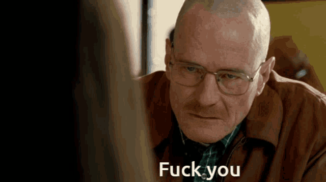 a bald man wearing glasses says " fuck you "