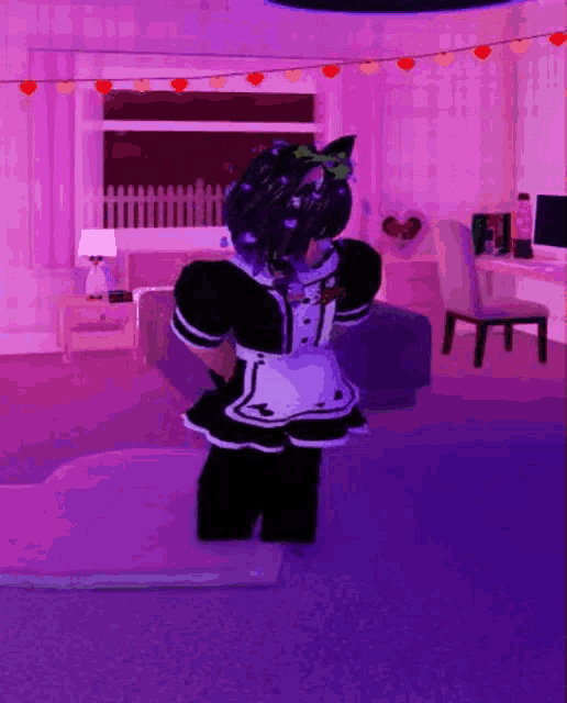 a girl in a maid outfit is standing in a living room with purple lights .