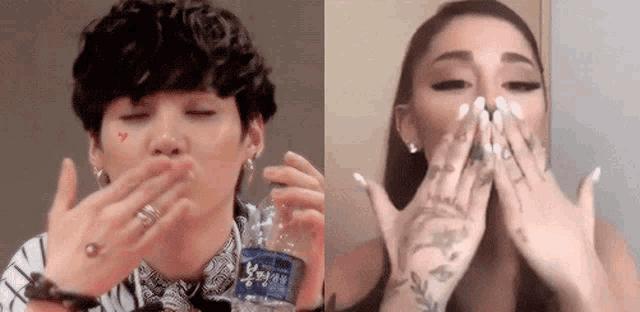 a man is blowing a kiss while holding a bottle of water and a woman is covering her face with her hands .