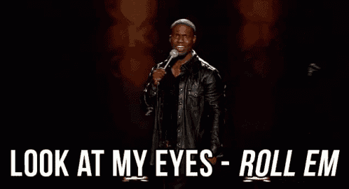 a man in a leather jacket is holding a microphone and saying `` look at my eyes roll em '' .