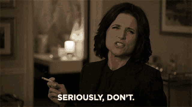 a woman smoking a cigarette with the words seriously don 't behind her