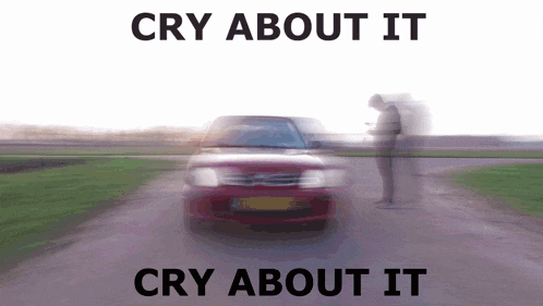 a blurry picture of a red car with the words cry about it