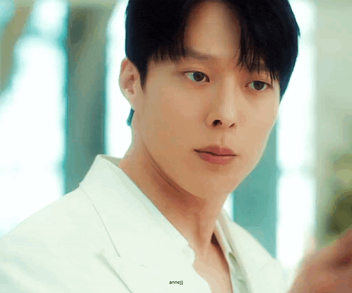 a close up of a man 's face with the word anneli written on the bottom