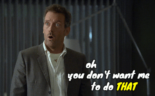 a man in a suit stands in front of a sign that says oh you don 't want me to do that