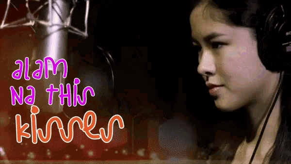 a woman wearing headphones is standing in front of a microphone with the words alam na this kiores written on the bottom