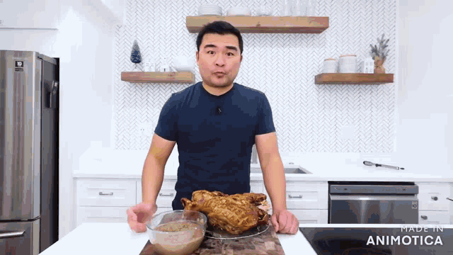 a man in a blue shirt is standing in front of a large piece of meat in a kitchen with the words made in animatica visible