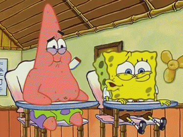 a cartoon of patrick and spongebob sitting at desks in a classroom