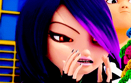 a close up of a cartoon character 's face with purple hair and red eyes .