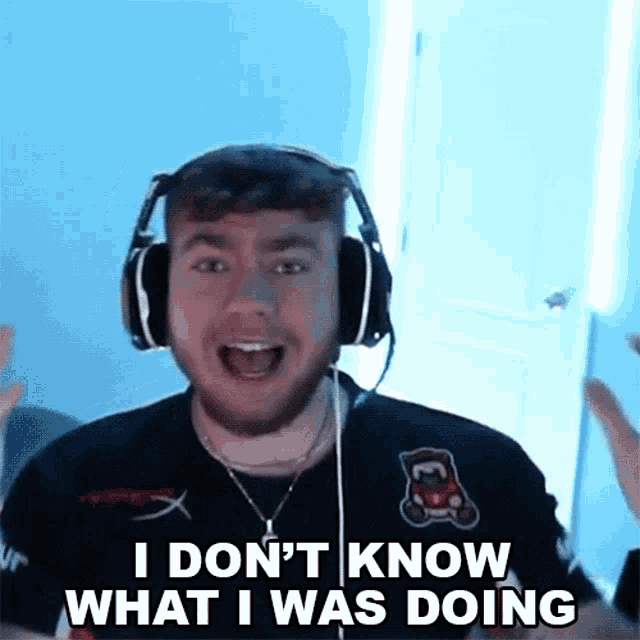 a man wearing headphones and a shirt that says i don 't know what i was doing