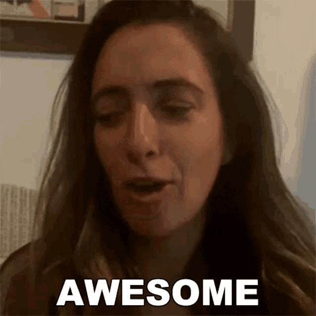a woman with long hair is making a face and saying awesome .