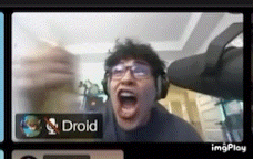 a man wearing headphones is making a funny face in a video call with drold