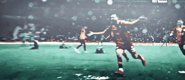 a soccer game is being played in a stadium with a sign that says ' allianz '
