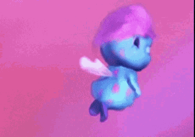 a blue cartoon character with a pink hat and wings is flying through the air .