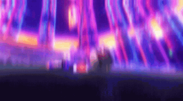 a blurry picture of a colorful background with purple and orange lights