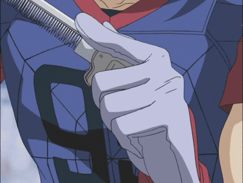 a close up of a person 's hand holding a comb with the letter g on it