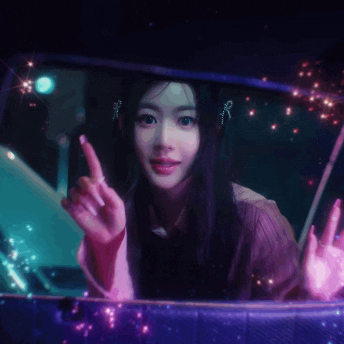 a woman is giving the middle finger in a car